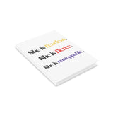 “She is…” Hardcover Notebook